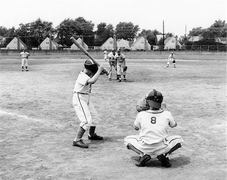 1960s LITTLE LEAGUE SCENE FROM BEHIND PLATE WITH PLAYER AT BAT Stock Photo - Rights-Managed, Code: 846-02792094