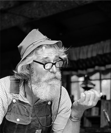 simsearch:846-02792220,k - 1970s OLDER MAN HILLBILLY CHARACTER WEARING CLOTH HAT OVERALLS GINGHAM SHIRT WITH GLASSES BEARD OUTDOOR Stock Photo - Rights-Managed, Code: 846-02792203