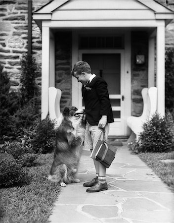 people shaking hands 1930s - 1930s BOY ON SIDEWALK SHAKING HANDS WITH COLLIE DOG AS HE LEAVES FOR SCHOOL Stock Photo - Rights-Managed, Code: 846-02792394