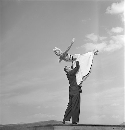 simsearch:846-02791806,k - 1940s BALLROOM DANCING COUPLE MAN LIFTING WOMAN INTO THE AIR Stock Photo - Rights-Managed, Code: 846-02792486