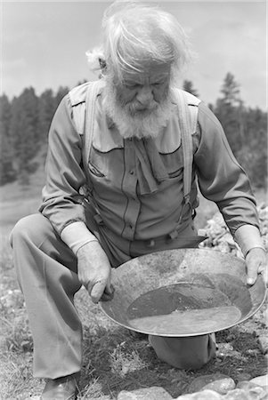 1940s ELDERLY BEARDED MAN PROSPECTOR PANNING FOR GOLD Stock Photo - Rights-Managed, Code: 846-02792502
