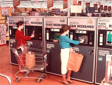 1970s WOMEN REDEEMING DEPOSIT ON CANS & BOTTLES AT SUPERMARKET REDEMPTION CENTER Stock Photo - Rights-Managed, Code: 846-02792696