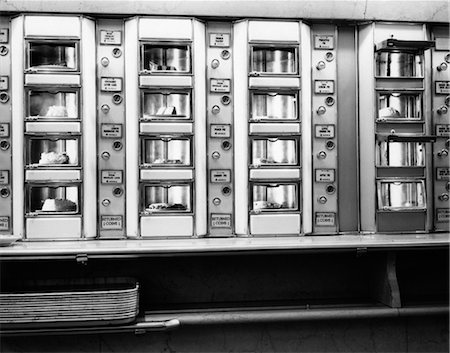 1960s SERIES AUTOMAT CAFETERIA VENDING MACHINE WINDOWS CONTAINING CAKE AND PIE DESSERTS Stock Photo - Rights-Managed, Code: 846-02792727