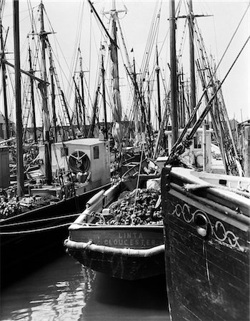 retro fishing - 1920s 1930s COMMERCIAL FISHING SHIPPING SHIPS BOAT BOATING BOATS SAIL SAILING SAILS FISH OCEAN MARINA Stock Photo - Rights-Managed, Code: 846-02792842