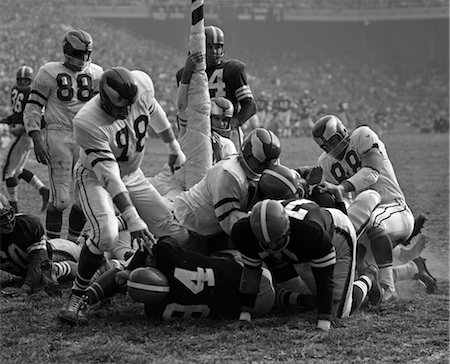 1950s CLOSE-UP OF PRO FOOTBALL GAME PILE-UP AROUND GOAL POST Stock Photo - Rights-Managed, Code: 846-02792859