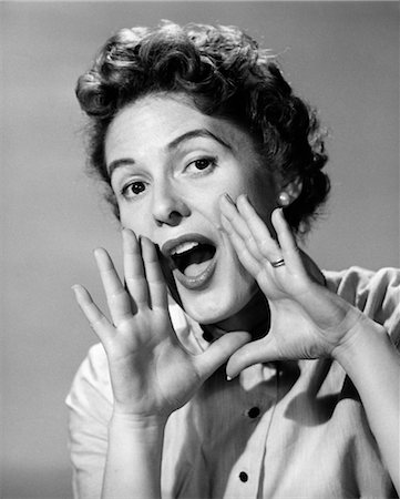 1950s CHARACTER WOMAN SHOUTING HANDS CUPPING MOUTH YELLING ANNOUNCEMENT LOOKING AT CAMERA Stock Photo - Rights-Managed, Code: 846-02792983