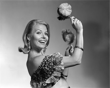 ruffled - 1960s SMILING BLOND WOMAN SHAKING NOISE MAKERS IN HER HANDS WEAR RUFFLED HALTER TOP LATIN MUSIC DANCE PERFORM Stock Photo - Rights-Managed, Code: 846-02793100