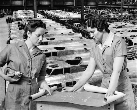 WOMEN WORKERS BLUEPRINTS FACTORY 1940s ROSIE RIVETER WOMAN WARTIME WORKER WW2 WWII WORLD WAR 2 AIRPLANE AIRPLANES Stock Photo - Rights-Managed, Code: 846-02793361