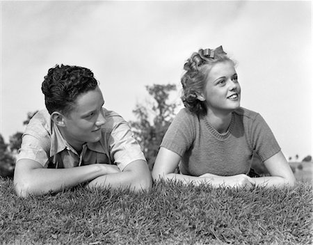 simsearch:846-02793798,k - 1930s 1940s YOUNG TEEN COUPLE LYING IN GRASS HEAD SHOULDERS PORTRAIT Stock Photo - Rights-Managed, Code: 846-02793692