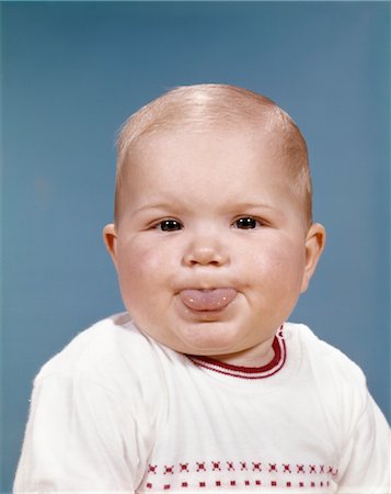 sassy - 1960s PORTRAIT OF CUTE BLOND CHUBBY BABY STICKING OUT TONGUE Stock Photo - Rights-Managed, Code: 846-02793967