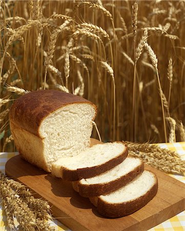 simsearch:846-03165636,k - 1980s LOAF OF SLICED BREAD HARVEST WHEAT BACKGROUND Stock Photo - Rights-Managed, Code: 846-03164260