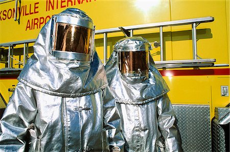 fire hazard - TWO PEOPLE IN SILVER FIRE FIGHTING SUITS Stock Photo - Rights-Managed, Code: 846-03164332