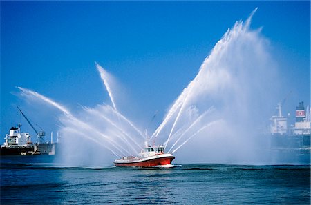 simsearch:846-02796426,k - FIREBOAT SHOOTING WATER IN AIR LOS ANGELES HARBOR CALIFORNIA Stock Photo - Rights-Managed, Code: 846-03164428