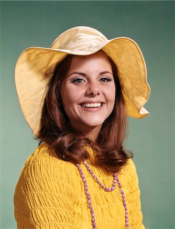 1970s SMILING YOUNG WOMAN WEARING YELLOW FLOPPY BRIM HAT AND BLOUSE WITH PINK BEADS Stock Photo - Rights-Managed, Code: 846-03164527