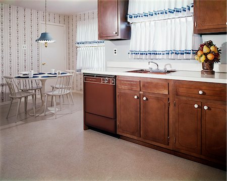 dining area - 1970s KITCHEN AND DINING AREA WITH DARK WOOD CABINETS AND BLUE AND WHITE CURTAINS Stock Photo - Rights-Managed, Code: 846-03164697