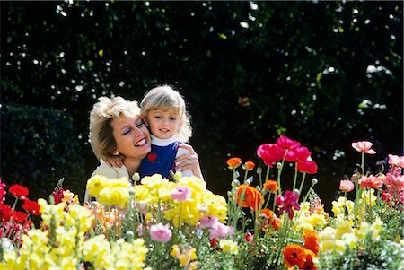 MOTHER HUGGING DAUGHTER IN GARDEN Stock Photo - Rights-Managed, Code: 846-03164872