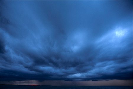 simsearch:846-03164221,k - DARK BLUE THUNDER STORM CLOUDS AT SUNSET Stock Photo - Rights-Managed, Code: 846-03164902