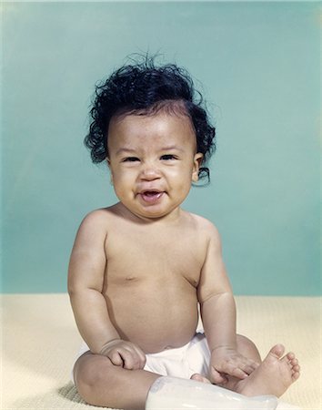 1960s PORTRAIT AFRICAN-AMERICAN BABY BOY WEARING DIAPER SMILING MAKING FACIAL EXPRESSION Stock Photo - Rights-Managed, Code: 846-03165098