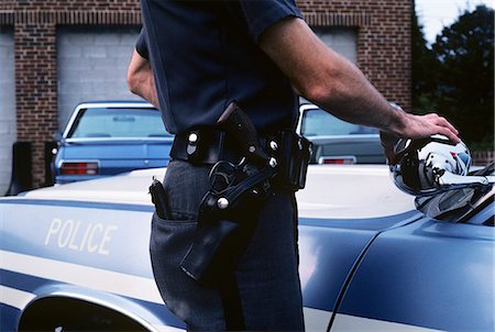 1970s DETAIL OF POLICE OFFICERS HIP WITH BELT GUN AND HOLSTER Stock Photo - Rights-Managed, Code: 846-03165188