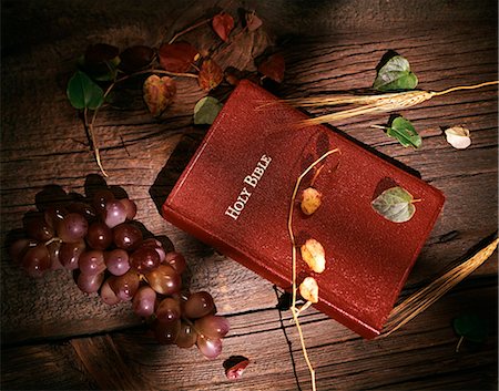 simsearch:846-03165636,k - STILL LIFE OF RED HOLY BIBLE ON WOODEN BACKGROUND WITH GRAPES & WHEAT SHADOW OF CROSS Stock Photo - Rights-Managed, Code: 846-03165573