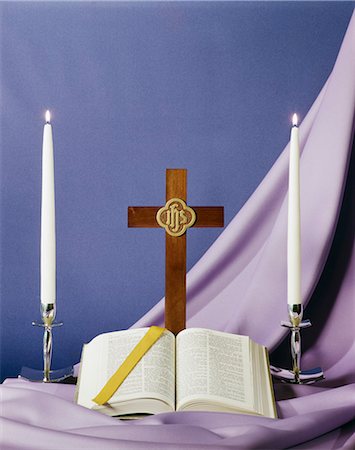 simsearch:846-03165636,k - BIBLE OPEN TO BOOK OF ISAIAH CROSS AND CANDLES ON PURPLE BACKGROUND Stock Photo - Rights-Managed, Code: 846-03165585