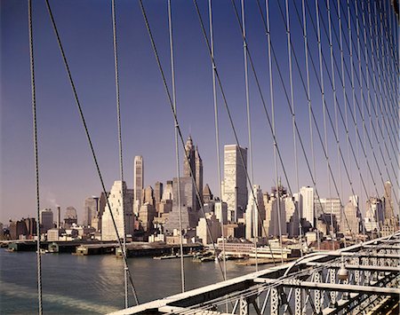 simsearch:846-02792671,k - 1960s SKYLINE DOWNTOWN MANHATTAN FROM BROOKLYN BRIDGE Stock Photo - Rights-Managed, Code: 846-03165726