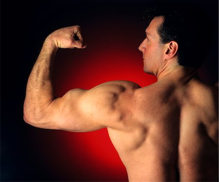 simsearch:846-02797740,k - MAN MAKING MUSCLE Stock Photo - Rights-Managed, Code: 846-03165924