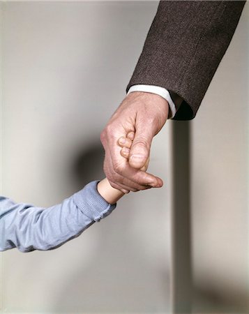 photograph old young hand - 1960s ADULT MAN HAND HOLDING THAT OF SMALL CHILD TODDLER FATHER YOUNG OLD SAFETY PROTECTION GUIDANCE Stock Photo - Rights-Managed, Code: 846-03165936