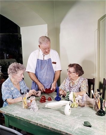 1960s ELDERLY MAN WOMEN WORKING ON CERAMIC ARTS CRAFTS RETIREMENT CENTER Stock Photo - Rights-Managed, Code: 846-03166006