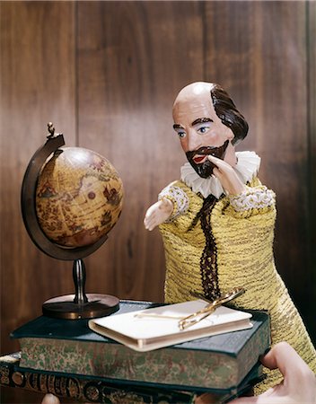 1960s 1970s WILLIAM SHAKESPEARE HAND PUPPET WITH BOOKS EYEGLASSES MINIATURE GLOBE Stock Photo - Rights-Managed, Code: 846-03166055