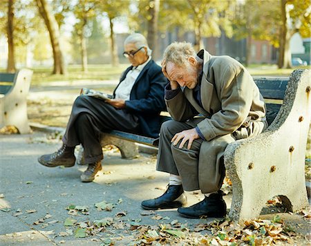 1970s ELDERLY MEN SITTING PARK BENCH HOMELESS BUM HOBO Stock Photo - Rights-Managed, Code: 846-03166180