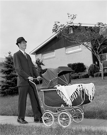 1960s MAN PUSHING STROLLER BABY CARRIAGE SUBURBAN SIDEWALK Stock Photo - Rights-Managed, Code: 846-03163216
