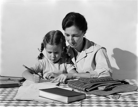 1960s CHILD DOING HOMEWORK WITH PARENT Stock Photo - Rights-Managed, Code: 846-03163452