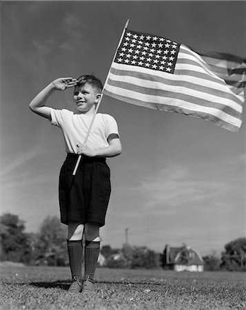 fourth of july - 1940s BOY HOLDING AMERICAN FLAG SALUTING WEARING SHORT PANTS Stock Photo - Rights-Managed, Code: 846-03163461