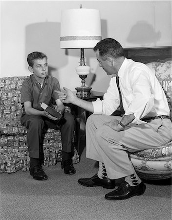 1960s MAN TALKING TO SON BOY SITTING CHAIR COUCH BOOK Stock Photo - Rights-Managed, Code: 846-03163600