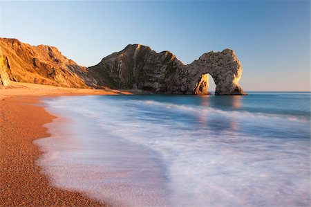 dorset - Durdle Door beach on a gorgeous sunny evening, Jurassic Coast, UNESCO World Heritage Site, Dorset, England, United Kingdom, Europe Stock Photo - Rights-Managed, Code: 841-05785056