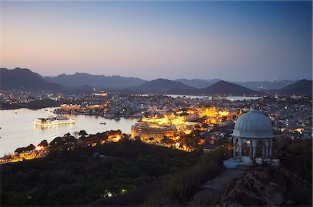 View of City Palace and Lake Palace Hotel at sunset, Udaipur, Rajasthan, India, Asia Stock Photo - Rights-Managed, Code: 841-05785331