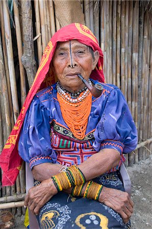 panama traditional costume - Kuna woman smoking a pipe, Playon Chico Village, San Blas Islands (Kuna Yala Islands), Panama, Central America Stock Photo - Rights-Managed, Code: 841-05785421