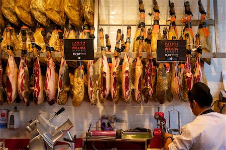 Cured hams (jamon serrano), for sale in market of Mercado de San Miquel, Madrid, Spain, Europe Stock Photo - Rights-Managed, Code: 841-05795900