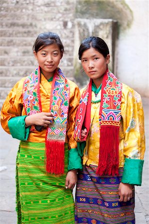 Two young woman in colourful national dress at the Wangdue Phodrang Tsechu, Wangdue Phodrang Dzong, Wangdue Phodrang (Wangdi), Bhutan, Asia Stock Photo - Rights-Managed, Code: 841-05845832