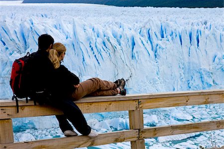 perito moreno glacier - Couple sitting watching the enormous Perito Moreno glacier, Los Glaciares National Park, UNESCO World Heritage Site, Patagonia, Argentina, South America Stock Photo - Rights-Managed, Code: 841-05846427