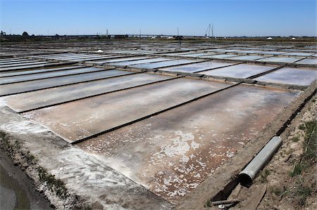 Salt is produced by evaporation under the sun in the salt pans of Aveiro, Beira Litoral, Portugal, Europe Stock Photo - Rights-Managed, Code: 841-05847155