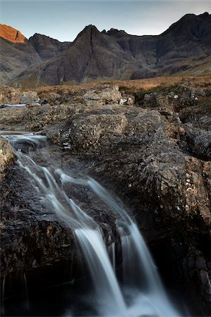 Last light on the Cuillin Hills from the Fairy Pools walk, Glen Brittle, Isle of Skye, Scotland, United Kingdom, Europe Stock Photo - Rights-Managed, Code: 841-05847628