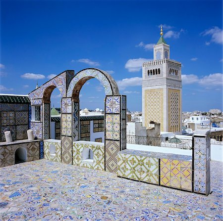 View over city and Great Mosque from tiled roof top, Tunis, Tunisia, North Africa, Africa Stock Photo - Rights-Managed, Code: 841-05848761