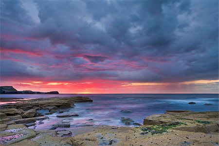 Sunset and stormy clouds at low tide in Saltwick Bay, Yorkshire, England, United Kingdom, Europe Stock Photo - Rights-Managed, Code: 841-05848822