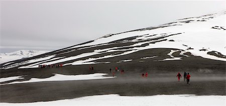 rim - Tourists crossing the mountains that rim the volcanic caldera of Deception Island, South Shetland Islands, Antarctic Peninsula, Antarctica, Polar Regions Stock Photo - Rights-Managed, Code: 841-05962372