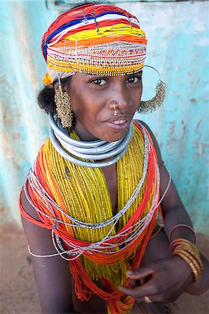 Bonda tribeswoman wearing traditional bead costume with beaded cap, large earrings and metal necklaces at weekly market, Rayagader, Orissa, India, Asia Stock Photo - Rights-Managed, Code: 841-06031731