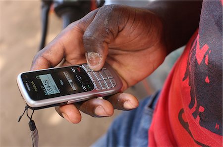 Mobile phone, Lome, Togo, West Africa, Africa Stock Photo - Rights-Managed, Code: 841-06032431