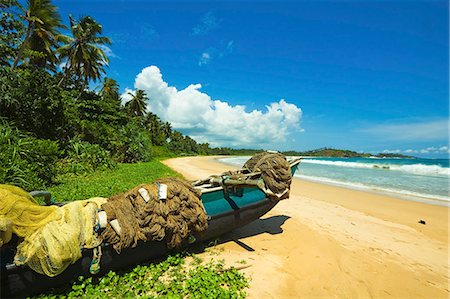 simsearch:841-06034119,k - Outrigger fishing boat and nets at this quiet south coast retreat beach, Talalla, near Matara, Southern Province, Sri Lanka, Asia Stock Photo - Rights-Managed, Code: 841-06032762