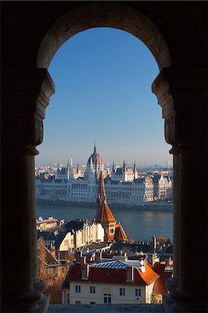 Parliament (Orszaghaz) and River Danube through arches of Fishermen's Bastion (Halaszbastya), UNESCO World Heritage Site, Buda, Budapest, Hungary, Europe Stock Photo - Rights-Managed, Code: 841-06033425